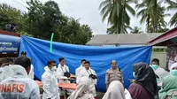 Proses Identifikasi Korban Longsor Tambang Suwawa yang dilakukan oleh Bid Dokkes Polda Gorontalo (Arfandi Ibrahim/Liputan6.com)