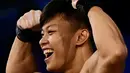 Dia memecahkan rekor dunia, rekor Asia dan rekor Asian Games dengan total angkatan 201 kg. (Ishara S.KODIKARA / AFP)