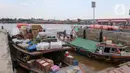 Dermaga 16 Ilir di tepian Sungai Musi, Palembang, Sumatera Selatan, sudah lama dikenal menjadi pusat perdagangan. (Liputan6.com/Herman Zakharia)