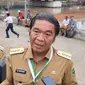 Pj Gubernur Banten Al Muktabar mengaku telah berkoordinasi dengan pemerintah pusat terkait banjir di Kota Tangerang dan Tangsel akibat limpasan Kali Angke. (Liputan6.com/Pramita Tristiawati)