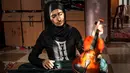 Dan, bermusik adalah cara bagi Jawaher al-Aqraa untuk "melarikan diri" dari kehidupan penuh tanda tanya di Gaza. (Eyad BABA/AFP)
