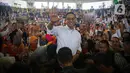 Calon presiden nomor urut 1 Anies Baswedan menyapa warga saat kampanye perdana di GOR Ciracas, Jakarta, Selasa (28/11/2023). Kampanye hari pertama Anies dilakukan di beberapa titik, antara lain kawasan Tanah Merah, GOR Ciracas, serta beberapa wilayah di kawasan Bogor, Jawa Barat. (Liputan6.com/Faizal Fanani)