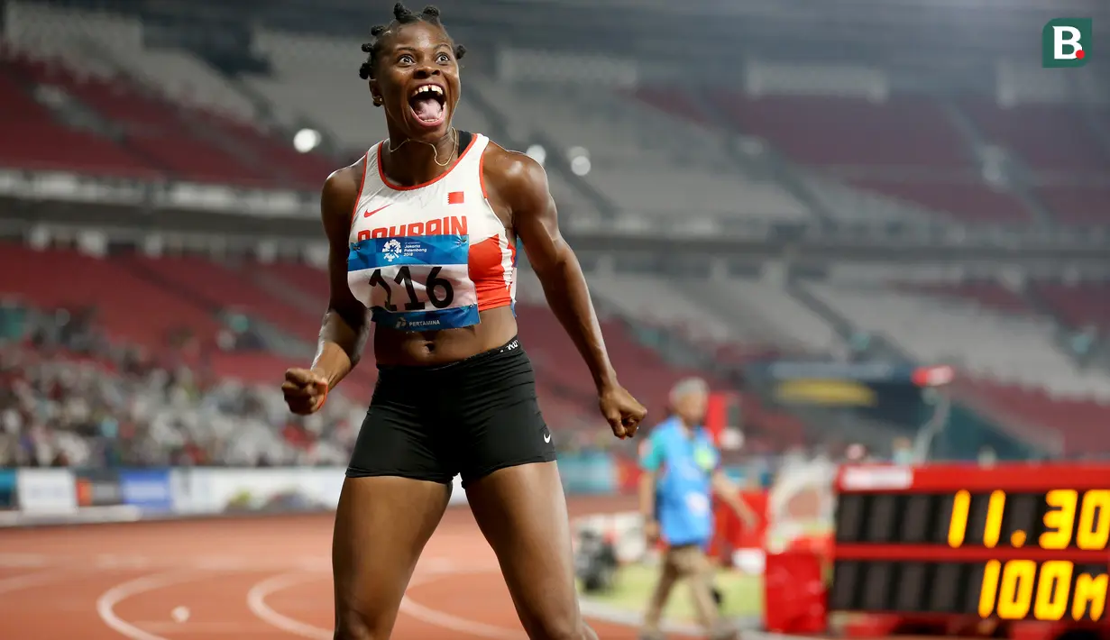 Ekspresi Edidiong Odiong pelari cepat asal Bahrain usai meraih medali emas di cabang atletik nomor 100 meter putri pada Asian Games 2018 di Stadion Utama Gelora Bung Karno, Senayan Jakarta, Minggu (26/8/2018). (Bola.com/Peksi Cahyo)