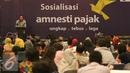 Kepala kantor wilayah DJP Jakarta Khusus Muhammad Haniv memberi sosialisasi Tex Amnesty di Jakarta, (23/8).  Sosialisasi dilakukan untuk memberikan edukasi dan sosialisasi tentang program pengampunan pajak pada pekerja seni. (Liputan6.com/Angga Yuniar)