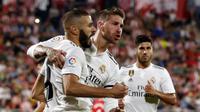 Para pemain Real Madrid merayakan gol ke gawang Girona pada laga La Liga di Stadion Municipal de Montilivi, Girona, Minggu (26/8/2018). (AFP/Pau Barrena Capilla)