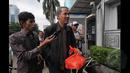 Mantan Dirjen Penyelenggara Haji dan Umroh Kemenag, Anggito Abimanyu, saat tiba di Gedung KPK, Jakarta, (26/1/2015). Anggito diperiksa sebagai saksi dugaan korupsi ibadah haji Tahun 2012-2013 dengan tersangka Suryadharma Ali.(Liputan6.com/Herman Zakharia)