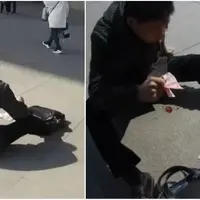 Seorang pria di Cina menyebarkan uang kertasnya saat terkena serangan jantung. (Sumber Foto: NextShark)