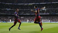 Suarez melakukan selebrasi usai jebol gawang Madrid (Reuters)