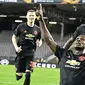 Striker Manchester United, Odion Ighalo, merayakan gol yang dicetaknya ke gawang LASK pada leg pertama 16 besar Liga Europa di Linzer Stadion, Linz, Austria, Jumat (13/3). Manchester United menang telak 5-0 atas LASK. (AP/Kerstin Joensson)