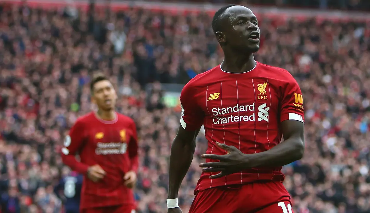 Sadio Mane - Mane menjadi bagian penting dalam trio lini depan Liverpool yang tampil apik di Liga Champions 2018/2019. Pemain asal Senegal ini berhasil mencetak empat gol dan tiga assist dalam perjalanan menuju tangga juara. (AFP/Geoff Caddick)