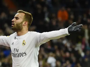 Striker Real Madrid, Jese Rodriguez, melakukan selebrasi usai mencetak gol ke gawang Sevilla pada laga La Liga di Stadion Santiago Bernabeu, Minggu (20/3/2016). Jese resmi meninggalkan PSG dan bergabung ke Stoke City. (AFP/Pierre-Philippe Marcou)