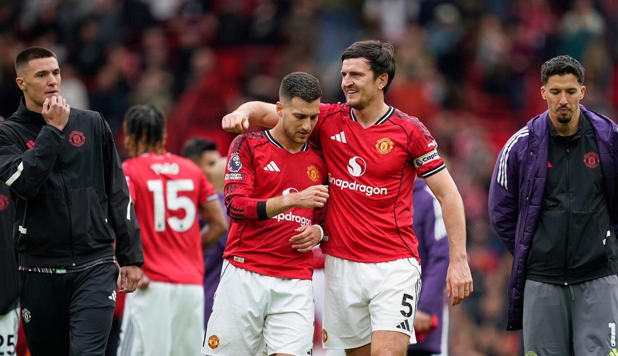 Hingga laga bubar, skor tak berubah, dan MU pun berhasil meraih kemenangan. Tambahan tiga poin juga memastikan Setan Merah sebuah tiket Liga Champions. (AP Photo/Dave Thompson)