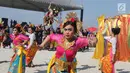 Penari Bali meramaikan Festival Ogoh-Ogoh di Pantai Lagoon Ancol, Jakarta, Minggu (18/3). Festival di Ancol ini melibatkan lebih dari enam ratus orang pendukung acara. (Liputan6.com/Arya Manggala)