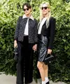 Tak sendirian, Kristen Stewart juga hadir bersama tunangannya, Dylan Meyer. Meyer tampil dalam balutan blus putih, rok kulit hitam, jaket cropped, dan tas Chanel. [@justjared]