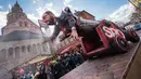 Kereta karnaval membawa karikatur  penantang Angela Merkel pada pemilihan tahun lalu, Martin Schulz saat parade karnaval Rose Monday di Duesseldorf, Jerman, Senin (12/2). Rose Monday tahun ini mengambil tema parodi tokoh politik (Andreas Arnold/dpa/AFP)