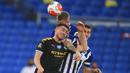 Pemain Manchester City, Aymeric Laporte, berebut bola dengan pemain Brighton and Hove Albion, Lewis Dunk, pada laga Premier League di Stadion Falmer, Sabtu (11/7/2020). Manchester City menang 5-0. (Adam Davy/Pool via AP)