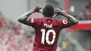 Striker Liverpool, Sadio Mane, melakukan selebrasi usai mencetak gol ke gawang West Ham pada laga Premier League di Stadion Anfield, Minggu (12/8/2018). Liverpool menang 4-0 atas West Ham. (AP/David Davies)