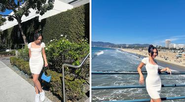 Foto kolase Beby Tsabina saat mengunjungi Santa Monica Beach, California. Beby tampil cantik dan seksi dalam balutan mini dress putih saat berada di pantai itu. (Instagram/bebytsabina)