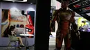 Karakter dan poster Iron Man ditampilkan untuk mempromosikan truk buatan produsen mobil China JMC sebelum pameran Auto Shanghai 2017 di National Exhibition and Convention Center di Shanghai, China (19/4). (AP Photo/Ng Han Guan)