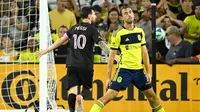 Inter Miami forward Lionel Messi (10) celebrates his goal behind Nashville SC defender Jack Maher, left, during the second half of a MLS soccer match Saturday, Oct. 28, 2025, in Nashville, Tenn.﻿ (AP Photo/John Amis)