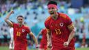 Gelandang Wales, Kieffer Moore menjadi penentu hasil imbang 1-1 lewat gol sundulannya ke gawang Swiss pada menit ke-73 memanfaatkan umpan lambung Joe Morrel. (Foto: AP/Darko Vojinovic/Pool)
