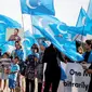 Banner Infografis Asal-usul Suku Uighur. (Liputan6.com/Triyasni)