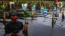 Penanaman 1.000 pohon mangrove dilakukan di Taman Wisata Alam Mangrove Angke Kapuk, Jakarta, pada Sabtu 7 Desember 2024. (Liputan6.com/Angga Yuniar)