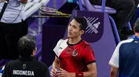 Ekspresi tunggal putra Indonesia, Jonatan Christie, saat bertanding di fase Grup L bulutangkis Olimpiade Paris 2024, di Port de la Chapelle Arena, Rabu (31/7/2024). (NOC Indonesia/Naif Muhammad Al'as/Canon Indonesia)