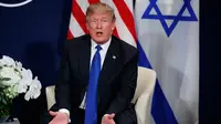 Presiden AS Donald Trump di sela Forum Ekonomi Dunia, Davos (25/1). Dalam pertemuannya Trump mengatakan Palestina sudah 'tidak menghormati' terkait keputusan kontroversialnya mengakui Yerusalem sebagai ibu kota Israel. (AP Photo / Evan Vucci)