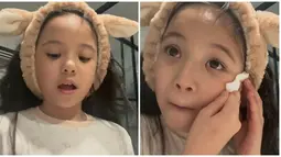 Lantaran rambut panjangnya mengganggu ketika ia membersihkan makeup, Gempi kemudian menggunakan bandana. Tak lupa ia pamer wajah lucunya setelah mengenakan bandana. Lanjutkan membersihkan makeup, sempat ada drama Gempi mengira cleanser yang digunakannya beracun ketika dipakai untuk bersihkan bibir. Tingkah Gempi ini sukses bikin tepuk jidat. (Liputan6.com/IG/@inigempiii)