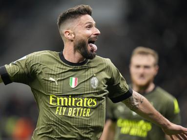 Pemain AC Milan Olivier Giroud merayakan setelah mencetak gol ke gawang Empoli yang kemudian dibatalkan setelah pemeriksaan VAR pada pertandingan sepak bola Serie A Liga Italia di Stadion San Siro, Milan, Italia, Jumat (7/4/2023). AC Milan gagal meraih kemenangan atas Empoli. (AP Photo/Luca Bruno)