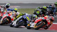 Balapan MotoGP San Marino di Sirkuit Misano, Minggu (13/9/2015), berlangsung penuh drama dan kejutan karena diselingi hujan dan dua kali ganti motor. (Reuters/Max Rossi)