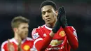 Penyerang Manchester United, Anthony Martial, tampak kecewa usai takluk dari West Bromwich Albion pada laga Liga Premier Inggris di Stadion The Hawthorns, Minggu (6/3/2016). WBA berhasil mennag 1-0 atas MU. (Reuters/Darren Staples)