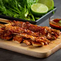 ilustrasi sate ayam/Image by jcomp on Freepik