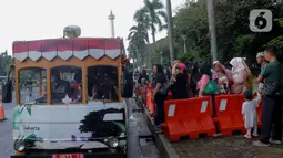 Monumen Nasional (Monas) masih menjadi pilihan warga untuk berwisata mengisi libur Lebaran 2025. (Liputan6.com/Herman Zakharia)