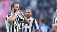 Gaya pemain Juventus, Gonzalo Higuain merayakan gol ke gawang Sassuolo pada lanjutan Serie A di Allianz Stadium, Turin (4/2/2018). Juventus menang 7-0. (Alessandro Di Marco/ANSA via AP)