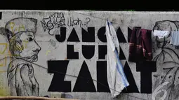 Coretan dinding atau mural mulai berkembang di Kota Jakarta sebagai bagian dari bentuk ekspresi untuk menyampaikan sebuah pesan untuk pembacanya (Liputan6.com/Faizal Fanani)