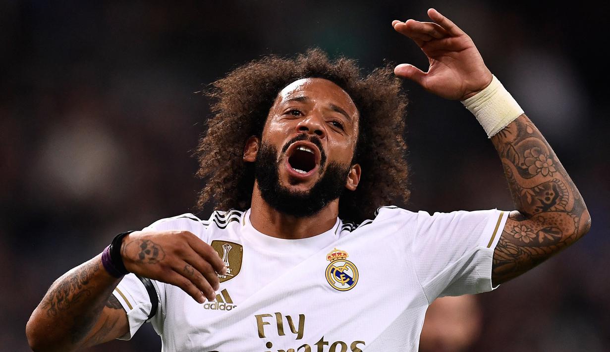 Marcelo. Bek kiri Brasil berusia 33 tahun ini mulai memperkuat Real Madrid pada pertengahan musim 2006/2007 usai didatangkan dari Fluminense. Total 14,5 musim, ia telah bermain dalam 539 laga di semua kompetisi dengan torehan 41 gol dan 101 assist. (Foto: AFP/Oscar Del Pozo)