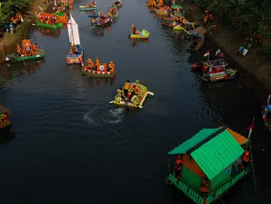 Pemerintah Provinsi  DKI Jakarta menggelar Festival Perahu Cinta Lingkungan (Cilung) di Banjir Kanal Timur, Duren Sawit, Jakarta Timur, Sabtu (27/7/2024). (Liputan6.com/Herman Zakharia)