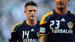 Robbie Keane bergabung dengan LA Galaxy pada 2011 setelah dipinjamkan oleh Tottenham Hotspur ke Celtic dan West Ham. Pria asal Irlandia itu sukses mengantongi 92 gol dalam 146 penampilannya. Selain itu, Keane juga berhasil mempersembahkan tiga Piala MLS untuk LA Galaxy dan terpilih menjadi MLS Best XI dalam empat musim berturut-turut antara 2012 dan 2015. Ia juga mendapatkan penghargaan MVP pada tahun 2014. (AFP/Frederic J. Brown)