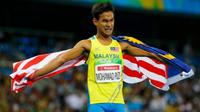 Sprinter Malaysia, Mohamad Ridzuan Mohamad Puzi, berselebrasi setelah merebut medali emas di nomor lari 100 meter T36 (celebral palsy) di Paralimpiade Rio 2016, Minggu (11/9/2016). (Reuters) 