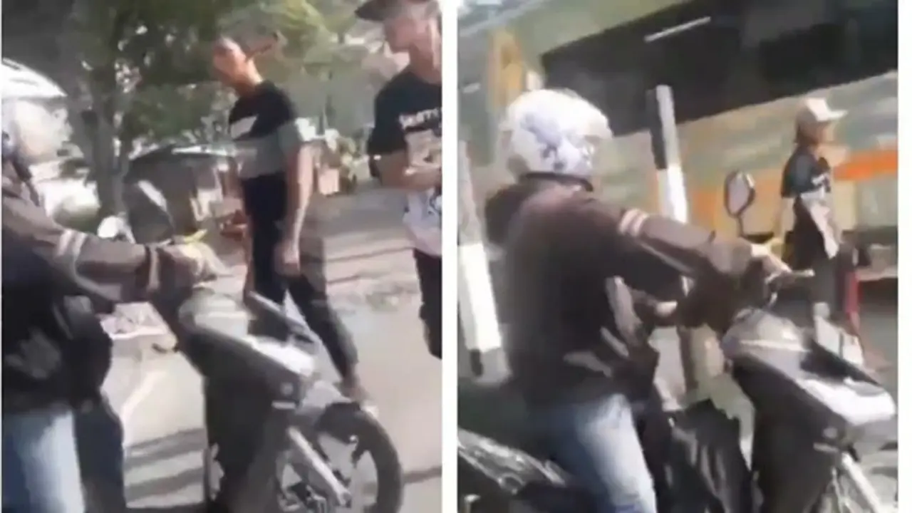 Aksi Pria Hentikan Pengendara Motor Terobos Rel Kereta Ini Bikin Salut