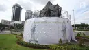 Suasana proses konservasi pada Patung Mohammad Husni Thamrin di Jakarta, Sabtu (25/11). Konservasi dilakukan untuk melestarikan cagar budaya serta merawat patung agar kondisinya tetap baik. (Liputan6.com/Immanuel Antonius)