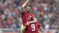 Marco Motta merayakan gol yang dicetak Marko Simic pada laga pembuka Shopee Liga 1 2020 antara Persija Jakarta melawan Borneo FC. (Bola.com/M Iqbal Ichsan)
