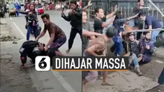 Massa yang kesal berusaha menghajar pelaku dengan celurit, balok kayu dan bambu.