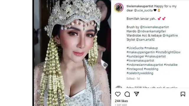 Ucie Sucita mengenakan pakaian pengantin.