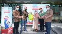 SGM Eksplor bersama Apotek K-24 membagikan 500 paket nutrisi di lima kota, di antaranya Surabaya. (Istimewa)