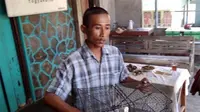 Tri Mulyadi ditetapkan sebagai tersangka lantaran dianggap menangkap kepiting di Muara Sungai Opak di bawah berat 200 gram. (Ridho Hidayat/JawaPos.com)