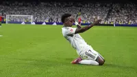 Selebrasi&nbsp;Vinicius Junior dalam laga Real Madrid versus Real Mallorca di La Liga 2025/2026, Minggu (31/8/2025). (AP Photo/Manu Fernandez)