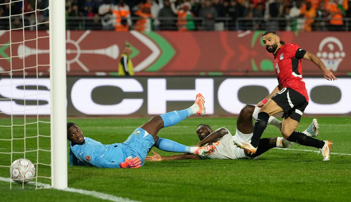 Kemenangan Mesir atas Pantai Gading pada laga perempat final Piala Afrika 2025, Sabtu (10/01/2026) waktu setempat, tak lepas dari peran Mohamed Salah. (AP Photo/Mosa'ab Elshamy)